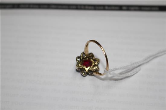 A yellow and white metal, ruby and diamond set oval cluster ring, (adapted),